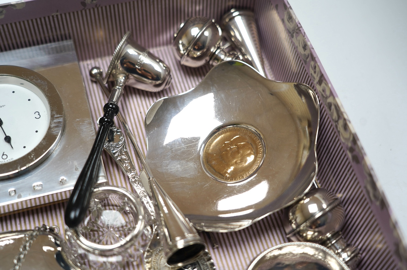 Sundry small silver including a late Victorian silver tea caddy (lid stuck), purse, tazza, modern timepiece, dish with inset coin, extinguisher, toddy ladle etc. and two plated items. Condition - poor to fair to good